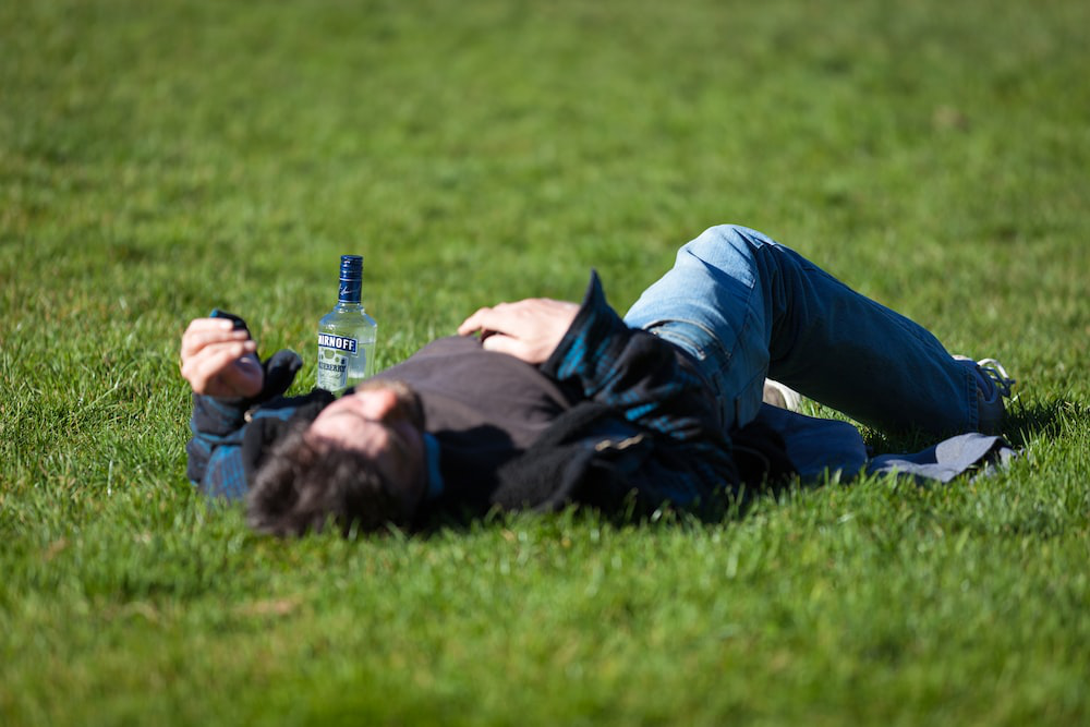 A person lying down on the grass