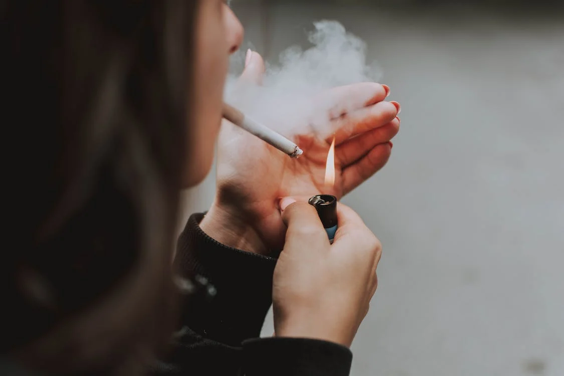 A teenager smoking a cigarette